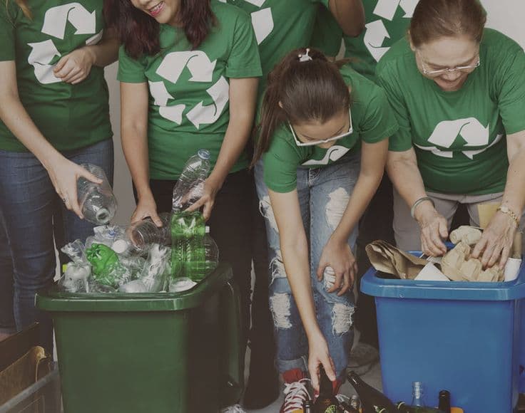 Collection of reusable shopping bags, water bottles, and containers symbolizing a zero waste lifestyle.